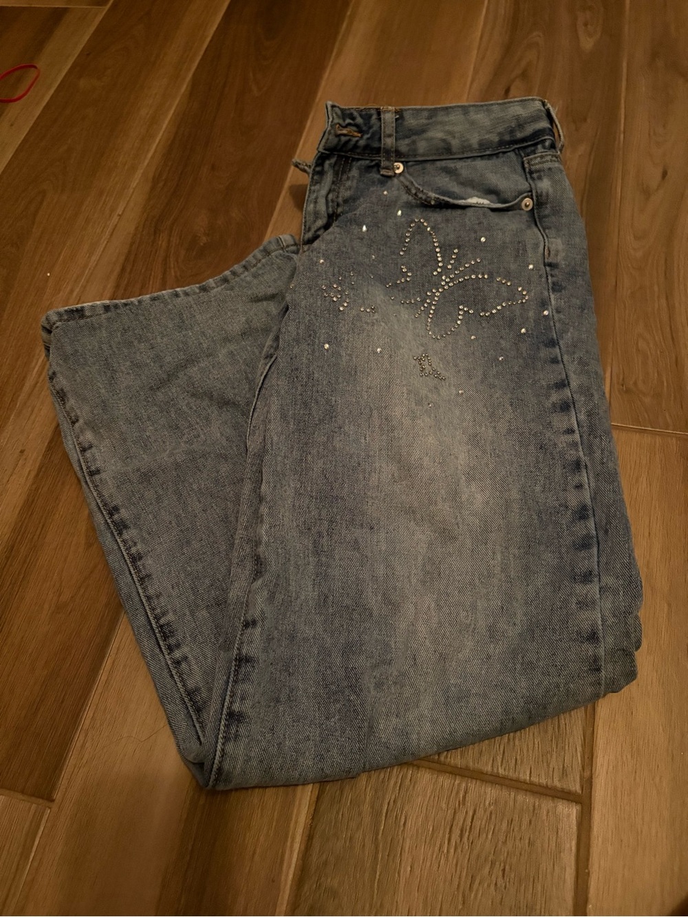 Women’s Light Blue Denim Jeans with Butterfly Rhinestone Accent